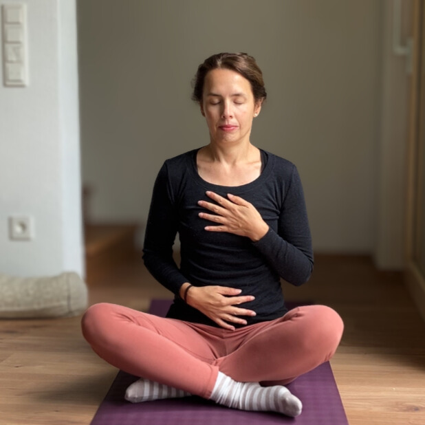 Woman in meditating pose